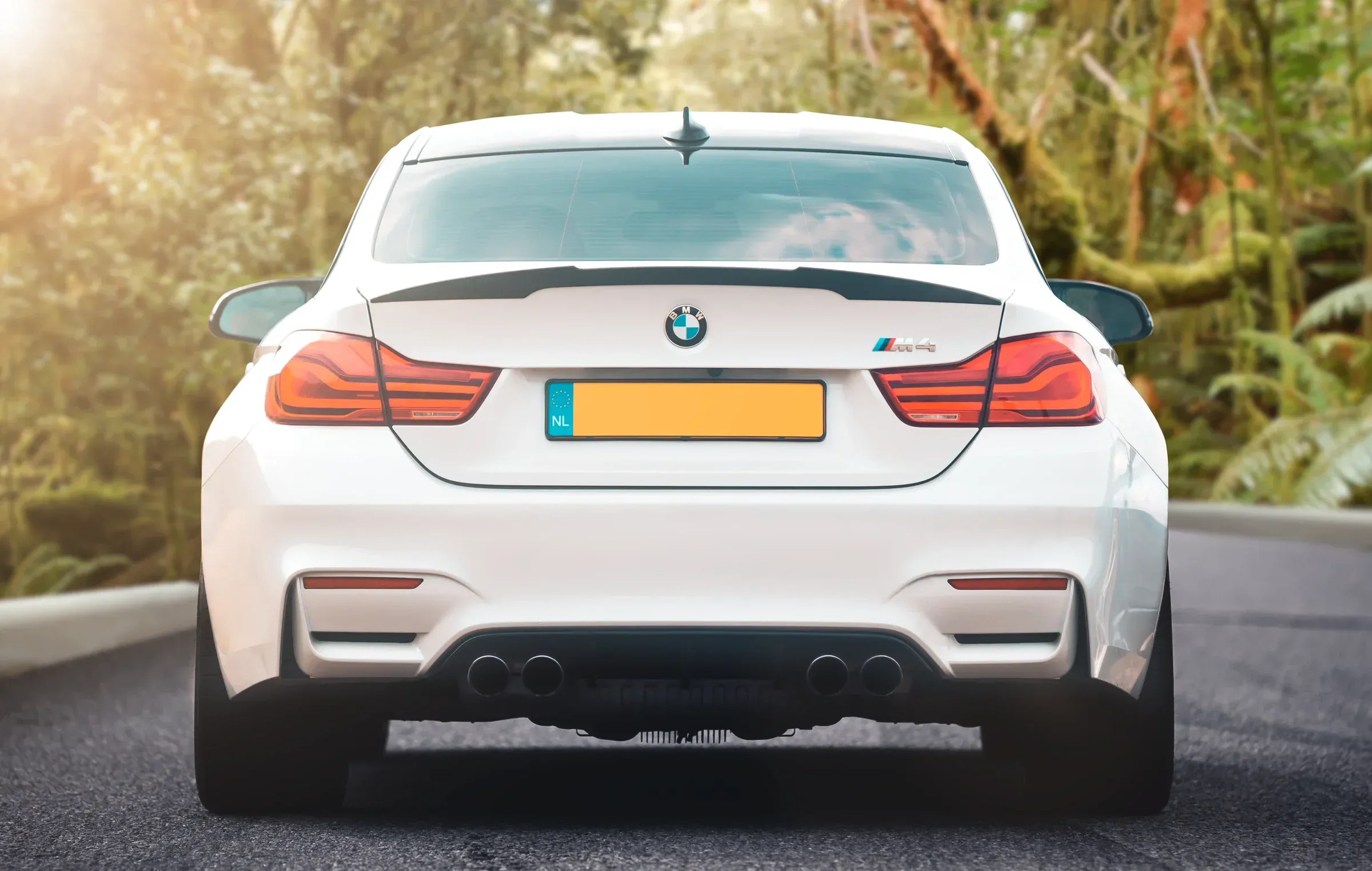 White BMW M4 pulled into a saturated tropical colour palette, warm and vivid